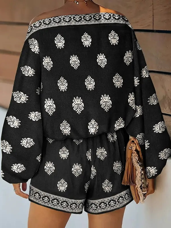 Mono con hombros descubiertos, manga farol y estampado - Negro