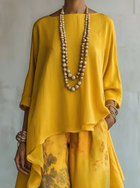 Conjunto de Pantalón Amarillo con corte asimétrico, pierna ancha y floral - Amarillo